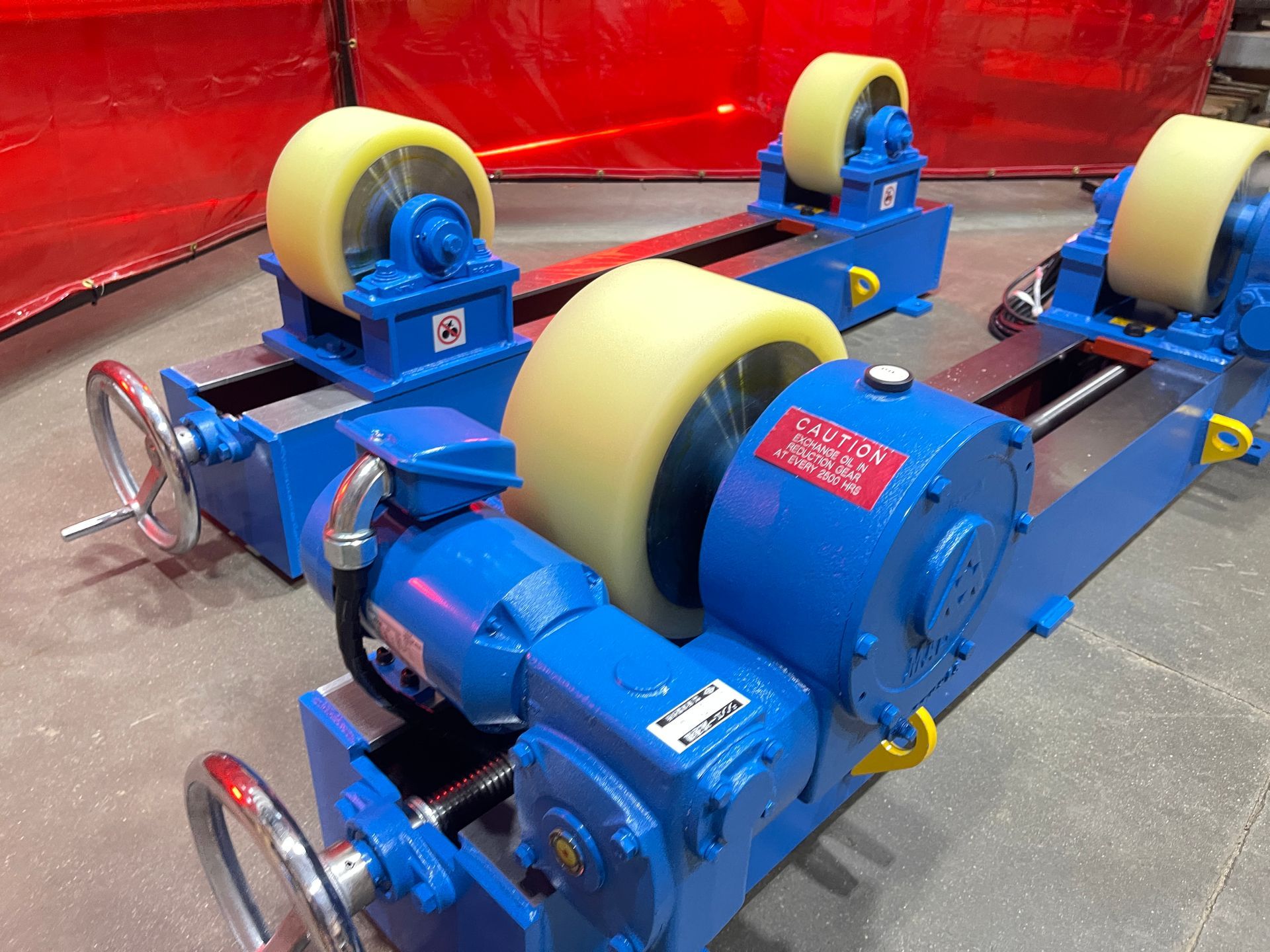A blue machine with a remote control attached to it