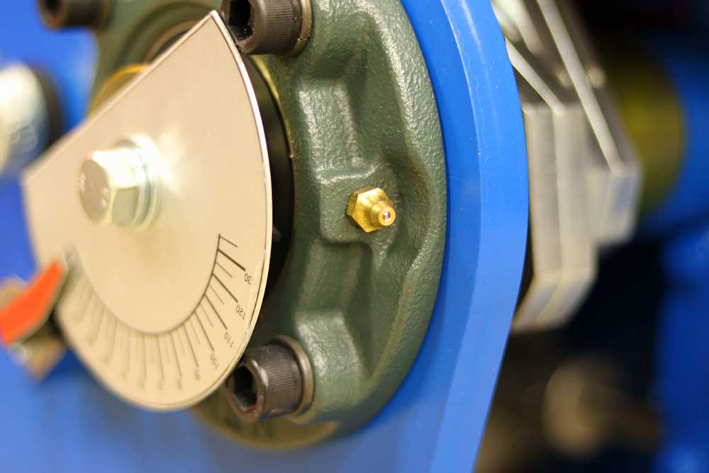 A close up of a machine with a clock on it