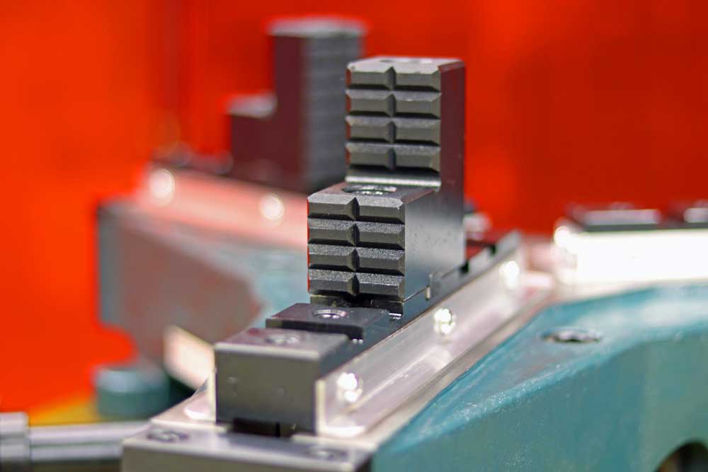 A close up of a piece of metal on a machine.