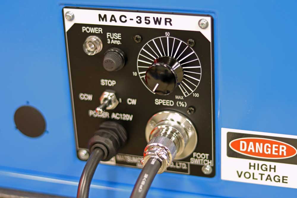 A blue box with a danger high voltage sign on it