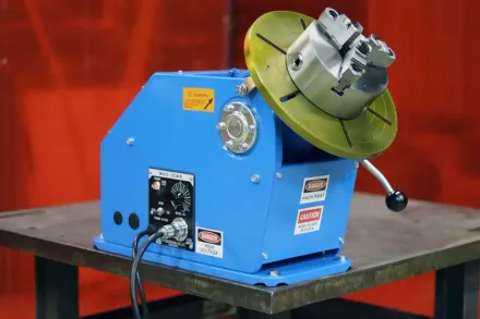 PS-1F Welding Positioner s sitting on top of a table.