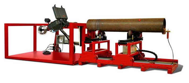 A red machine is cutting a pipe on a white background.