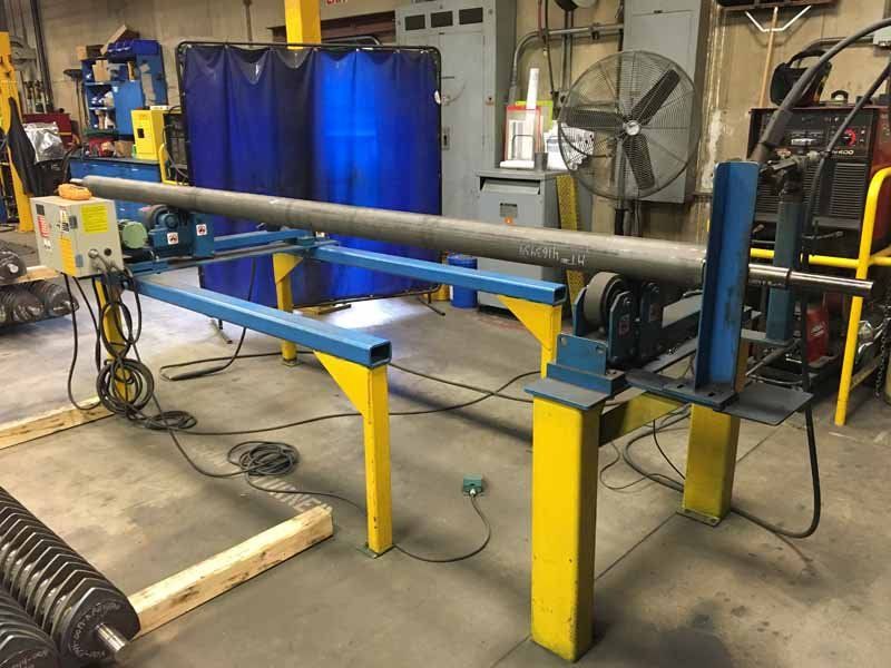 A machine is sitting in a room with a fan.