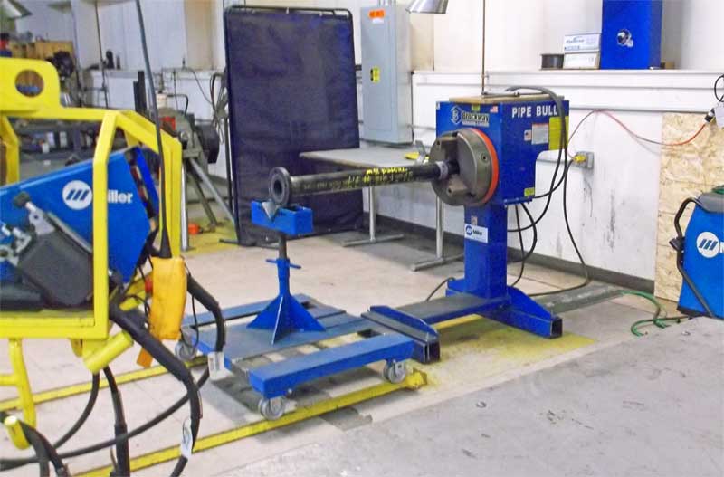 A blue and yellow machine with the word miller on it