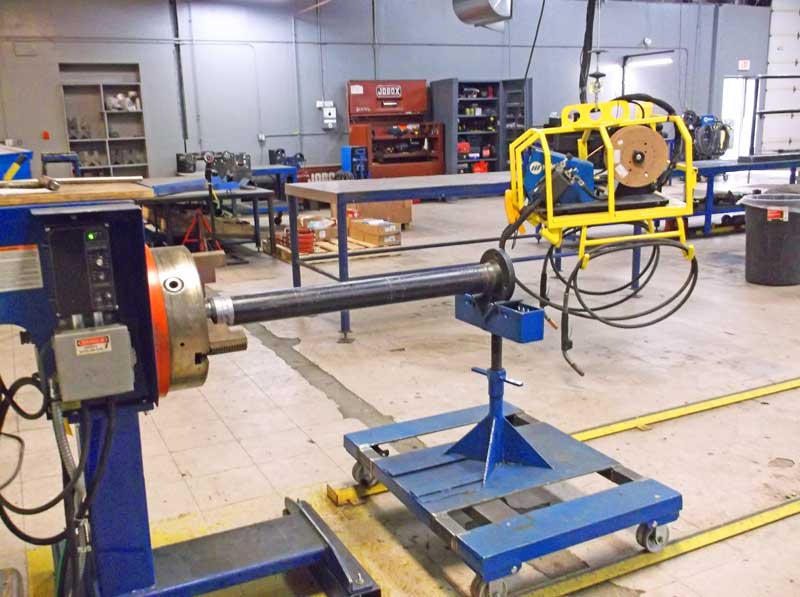 A machine is sitting on a cart in a factory