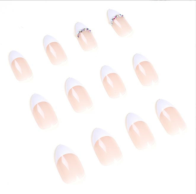 A close up of a woman 's hand with a ring on her finger