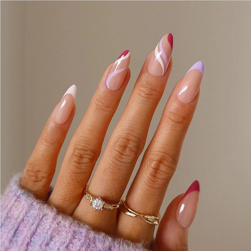 A close up of a person 's nails with rings on their fingers.