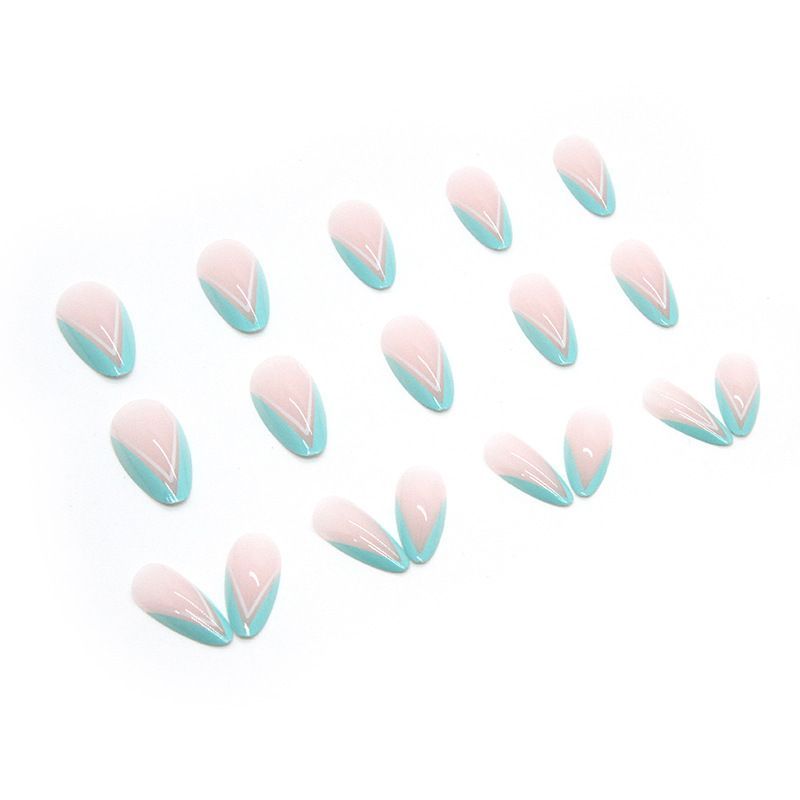 A woman 's hand with long nails and a ring on her finger