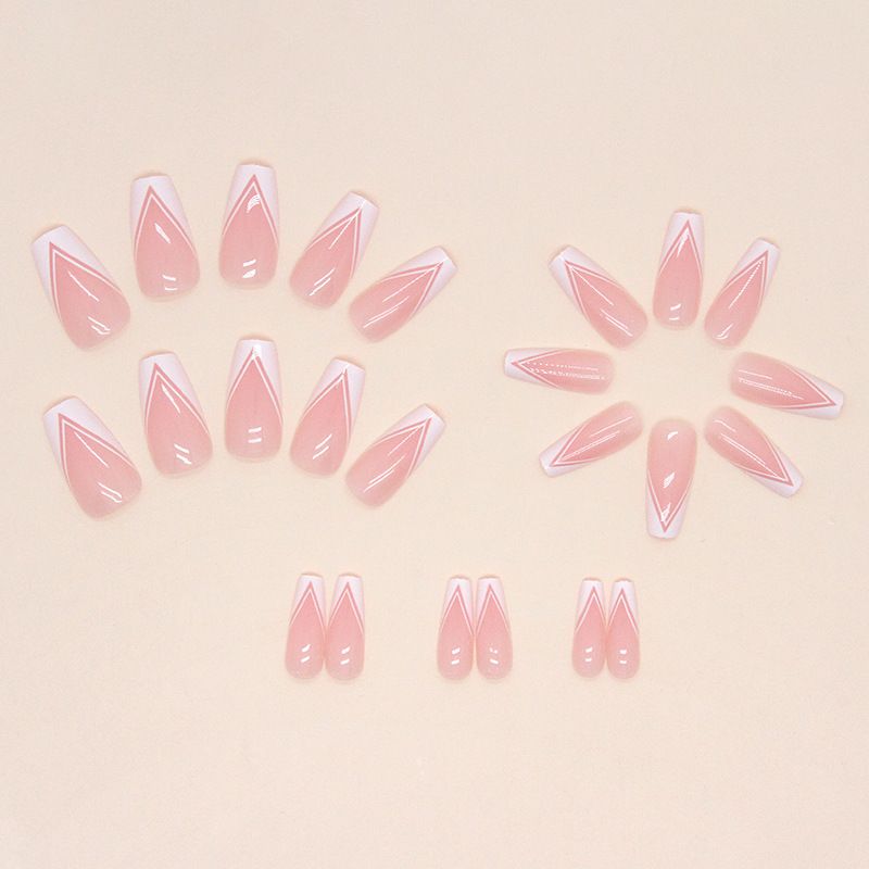 A close up of a woman 's nails with a white french manicure.