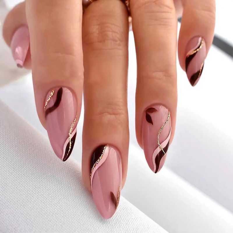 A close up of a woman 's nails with a design on them
