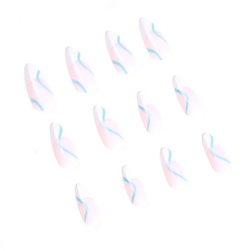 A close up of a person 's nails with a ring on their finger.