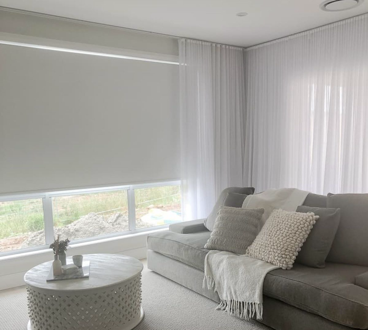 A Close Up Of A Row Of White Shutters On A Window — Modern Window Furnishings In Bargara, QLD