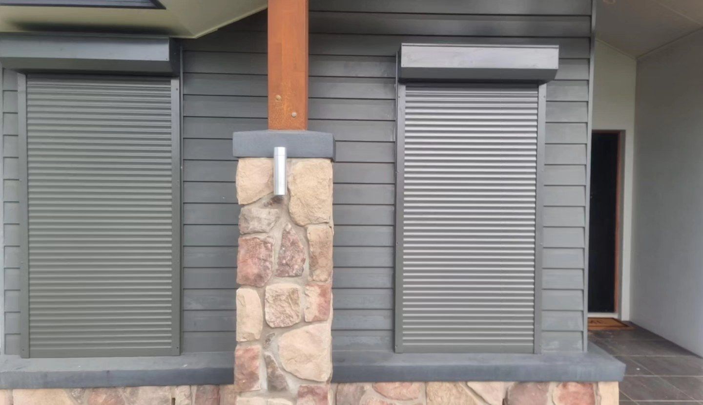 A Bathroom With White Shutters On The Door And A Mirror — Modern Window Furnishings In Agnes Water, QLD
