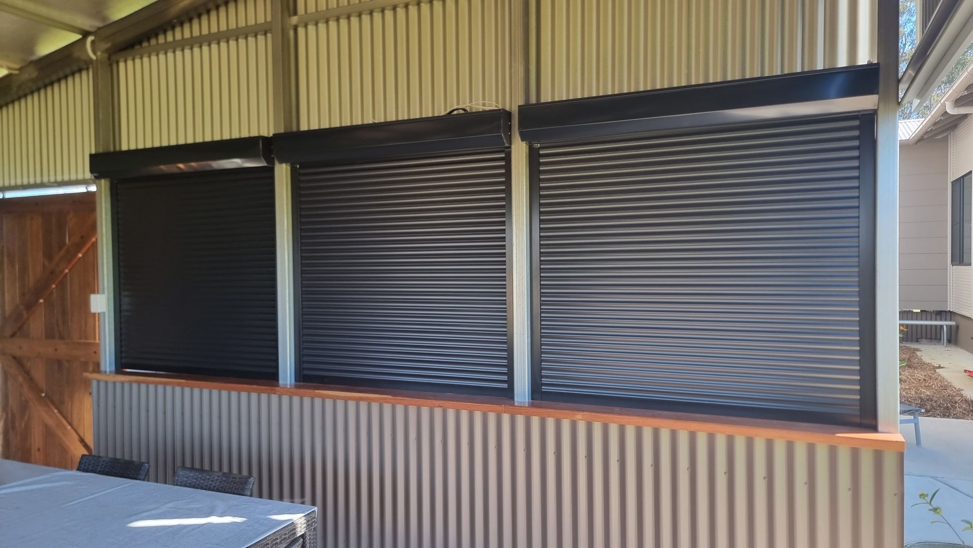 A Close Up Of A Row Of White Shutters On A Window — Modern Window Furnishings In South Kolan, QLD