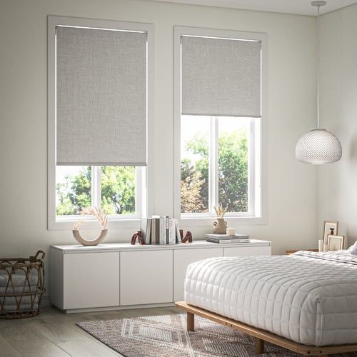 A Bedroom With A Bed And Two Windows With Blinds — Modern Window Furnishings In Bundaberg East, QLD