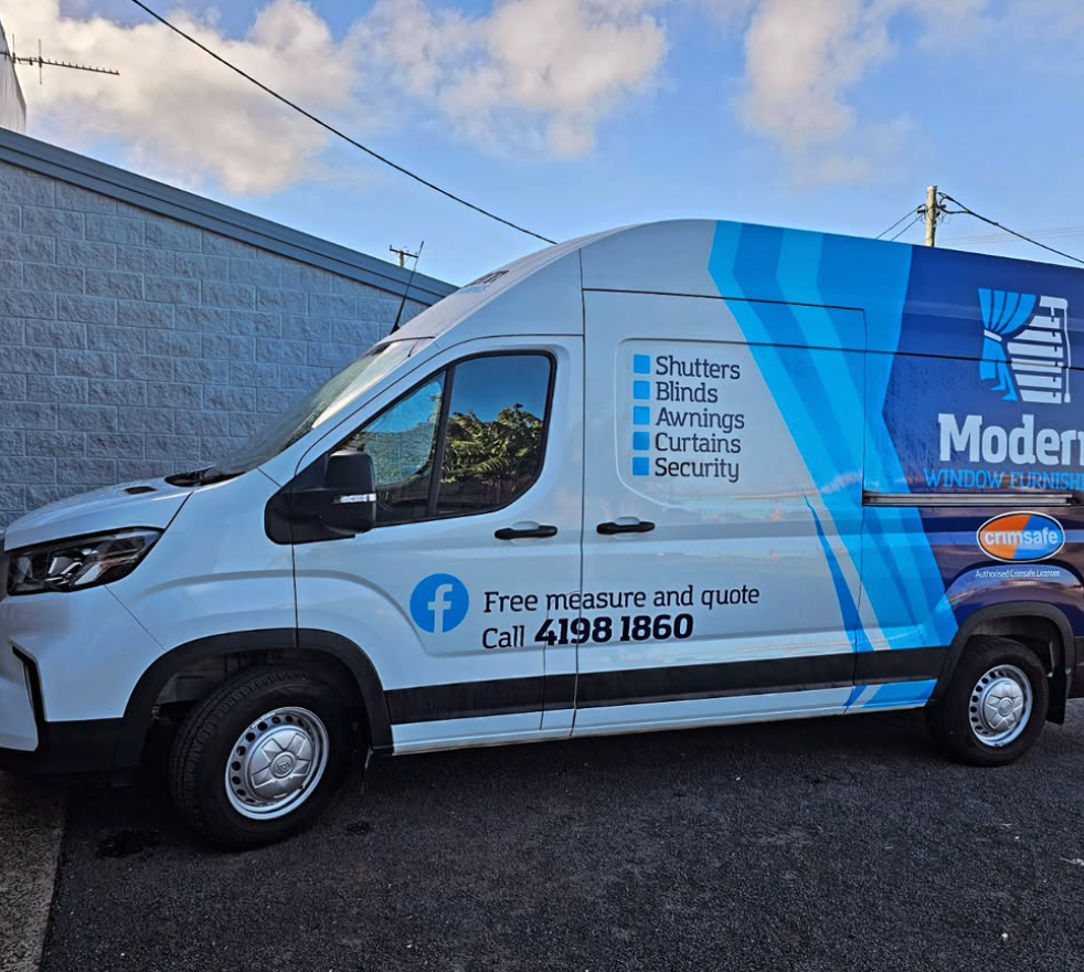 A Man Is Standing In Front Of A Modern Window Furnishings Van — Modern Window Furnishings In Bundaberg East, QLD