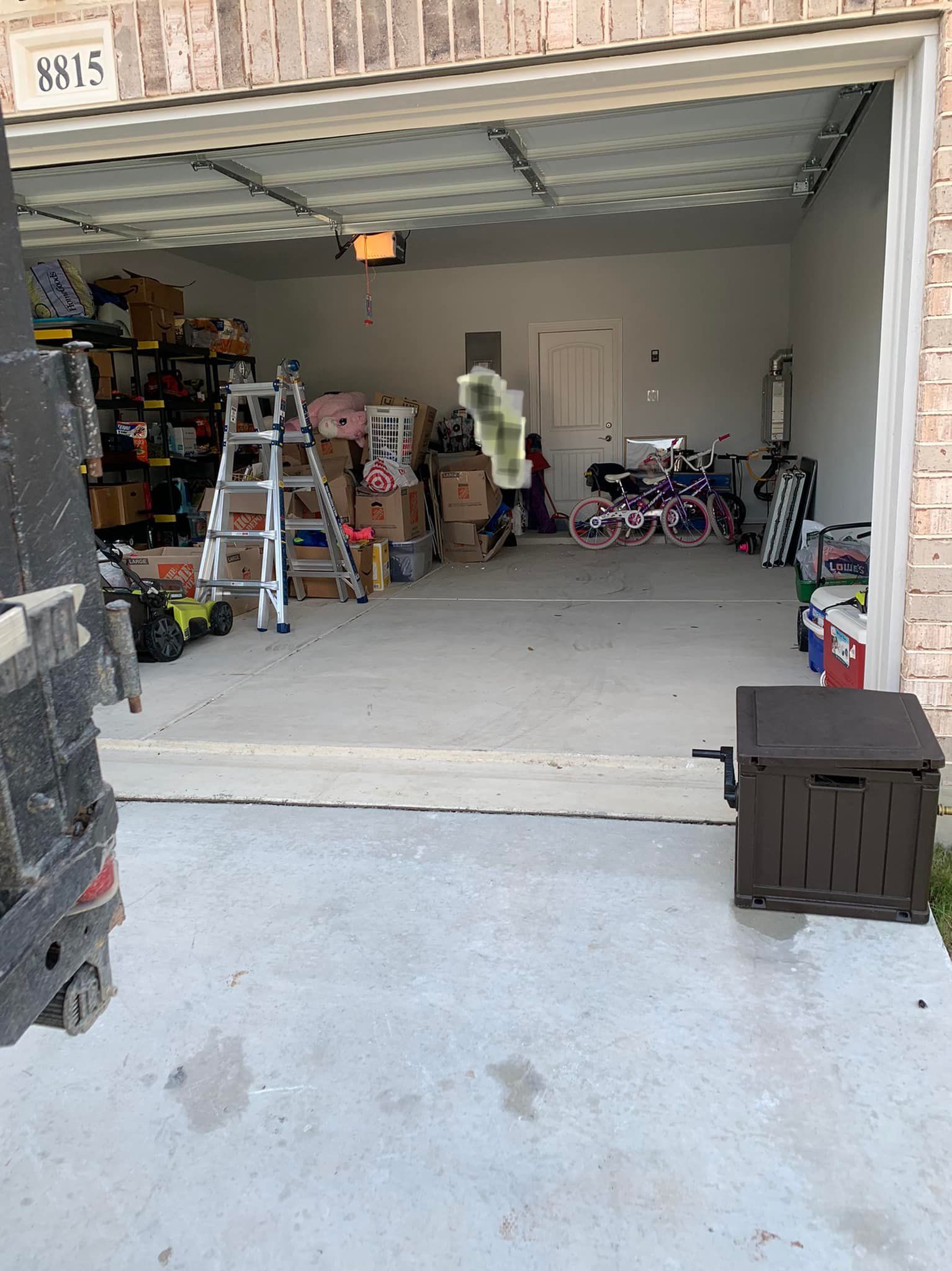 A garage filled with lots of toys and boxes.