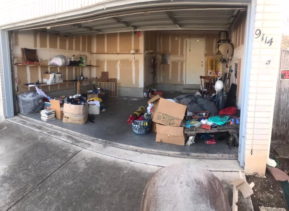A garage filled with lots of boxes and other items.