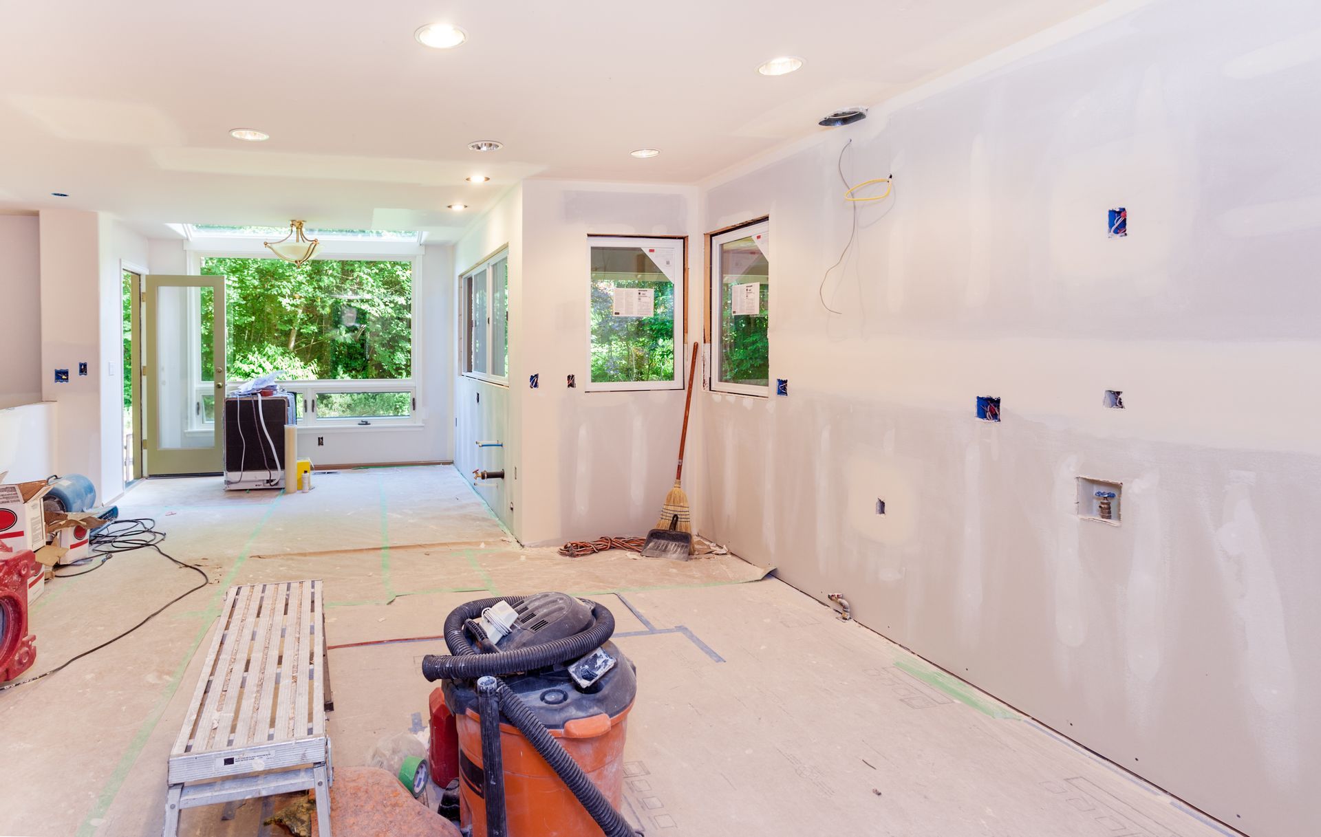 Kitchen drywall installation in progress.