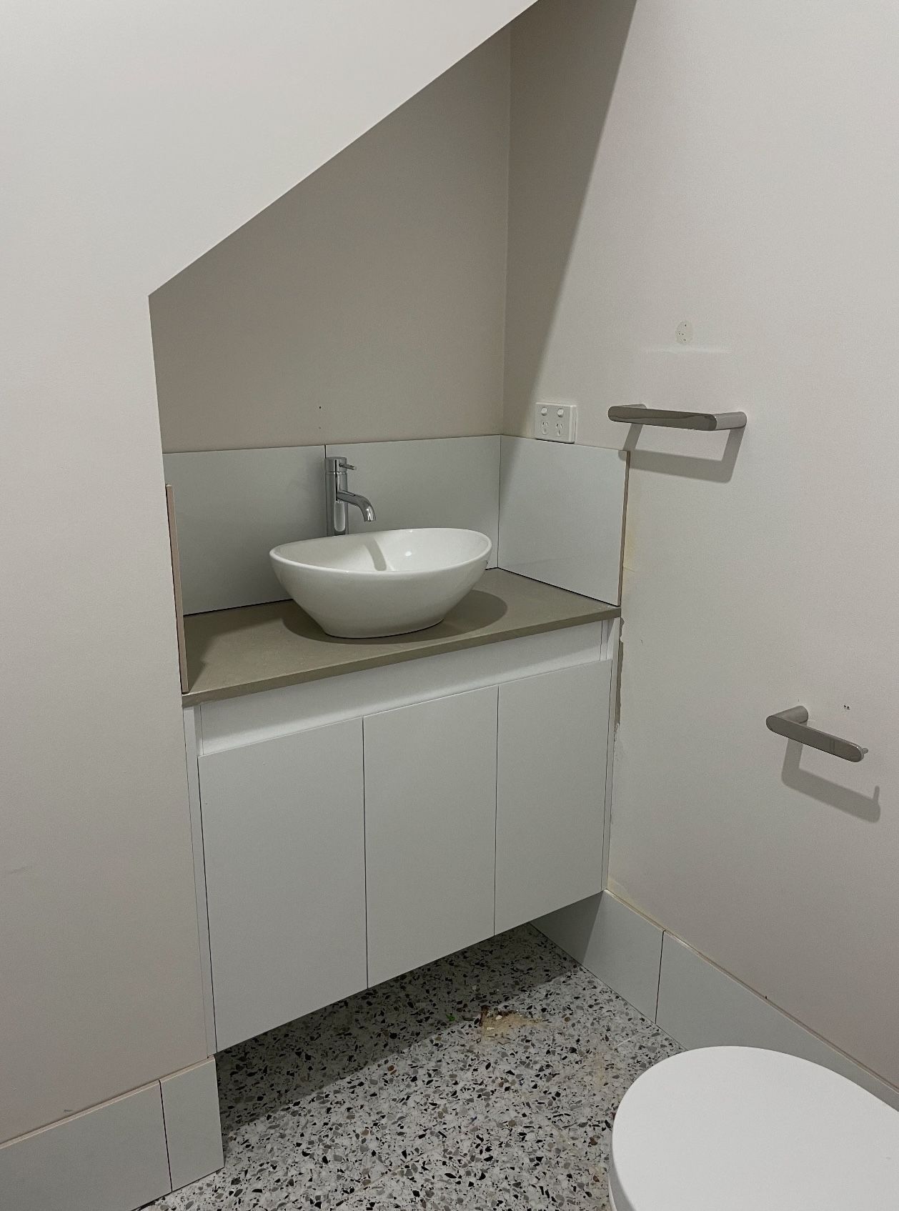 A bathroom with a sink and toilet 