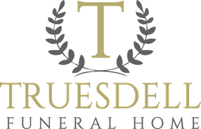The logo for truesdell funeral home has a laurel wreath around the letter t.