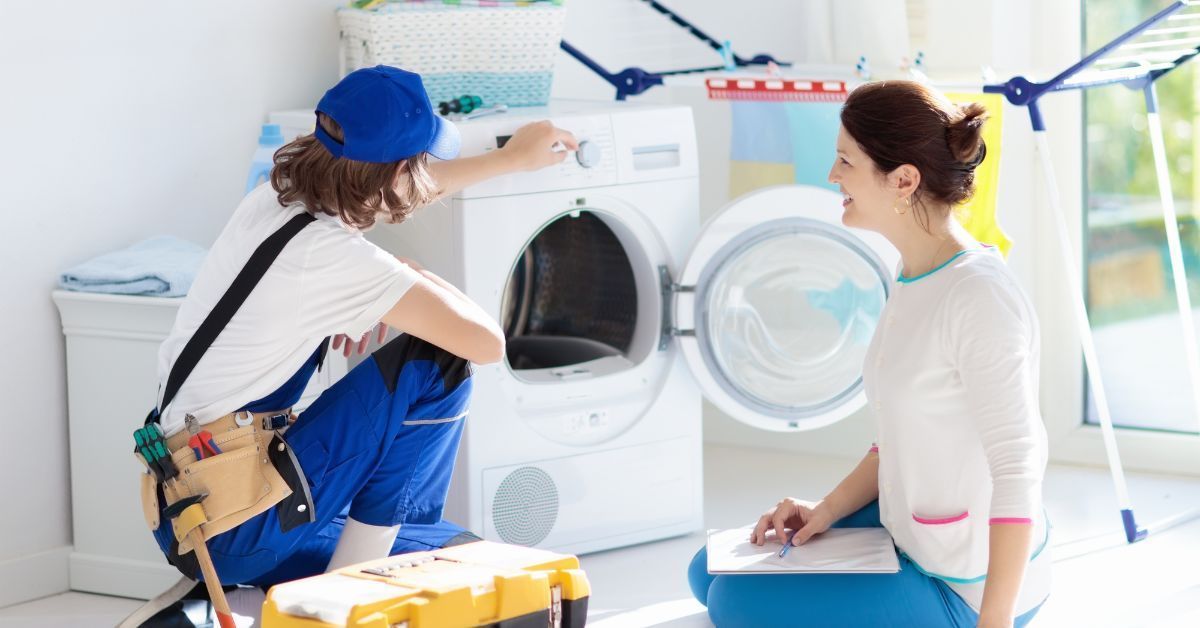 HVAC technician repairing dryer