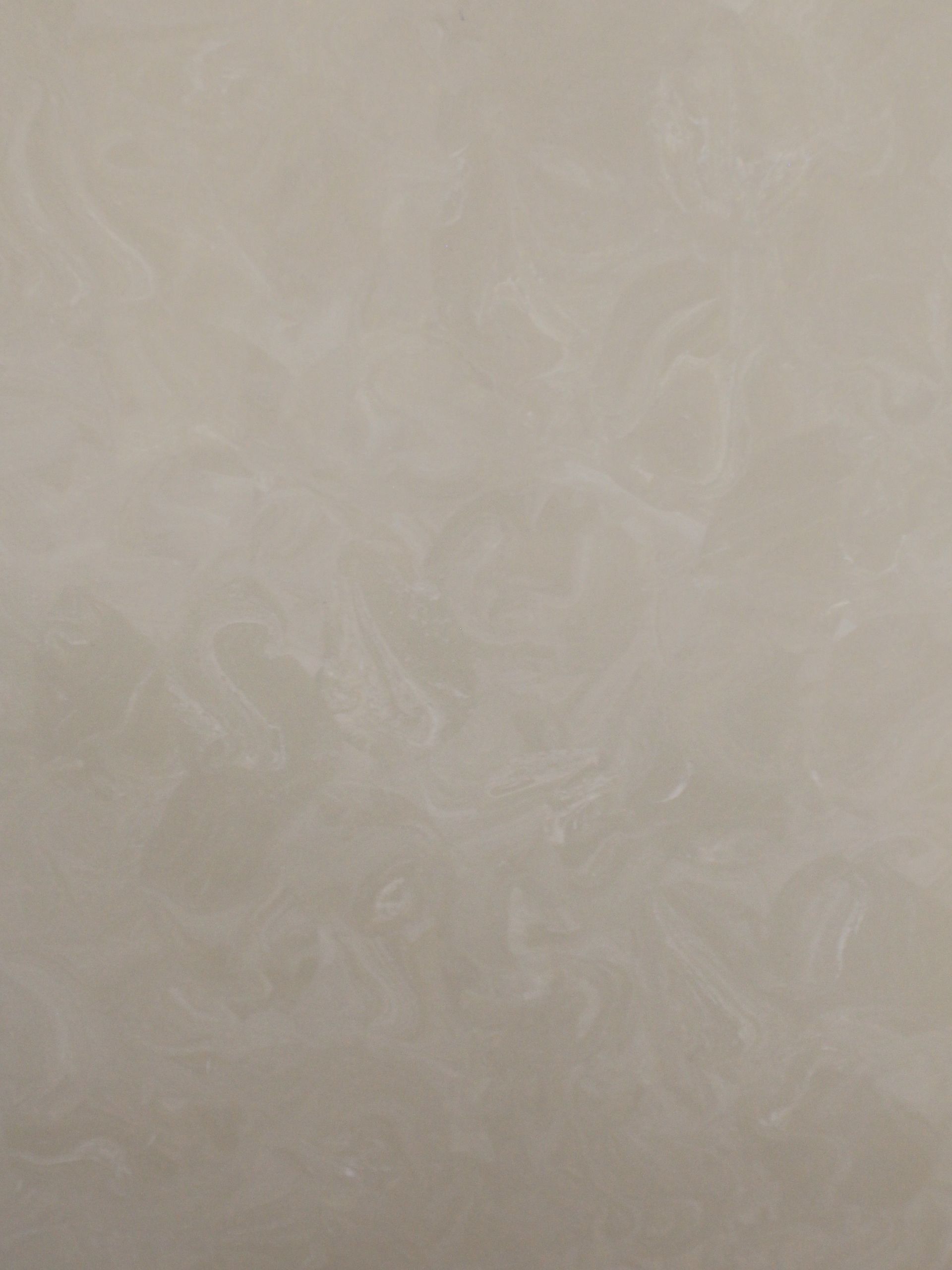 A close up of a white surface with a grainy texture.