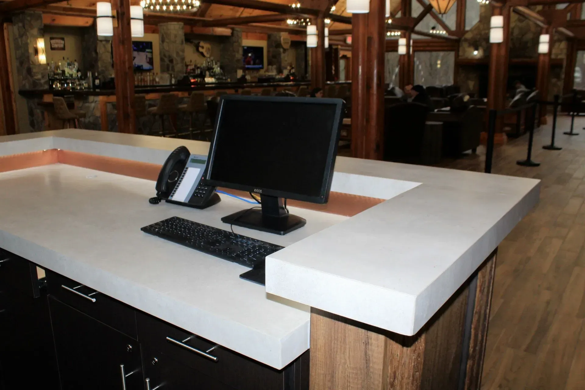 A desk with a computer and a phone on it