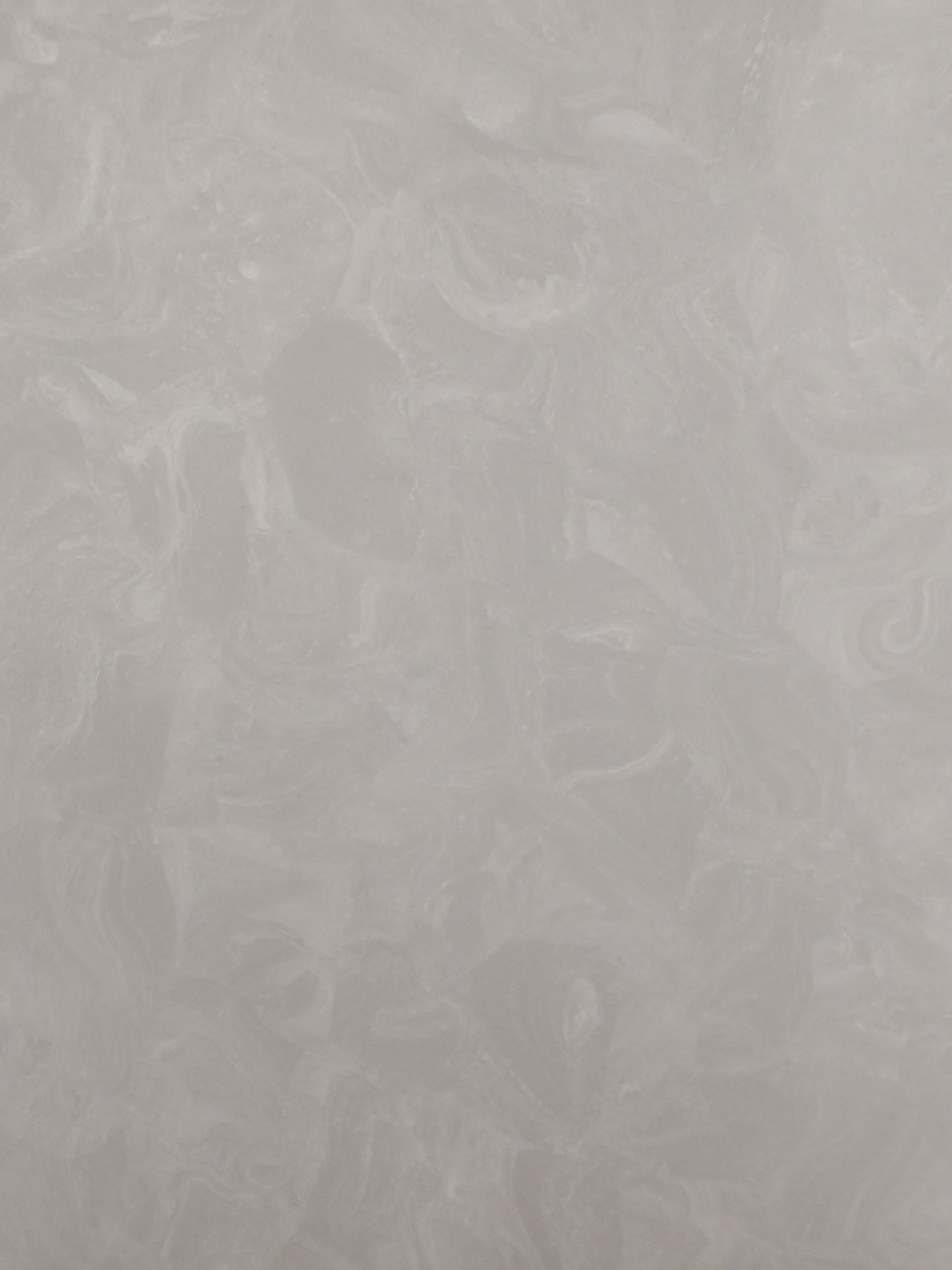 A close up of a gray tile with a marble texture.