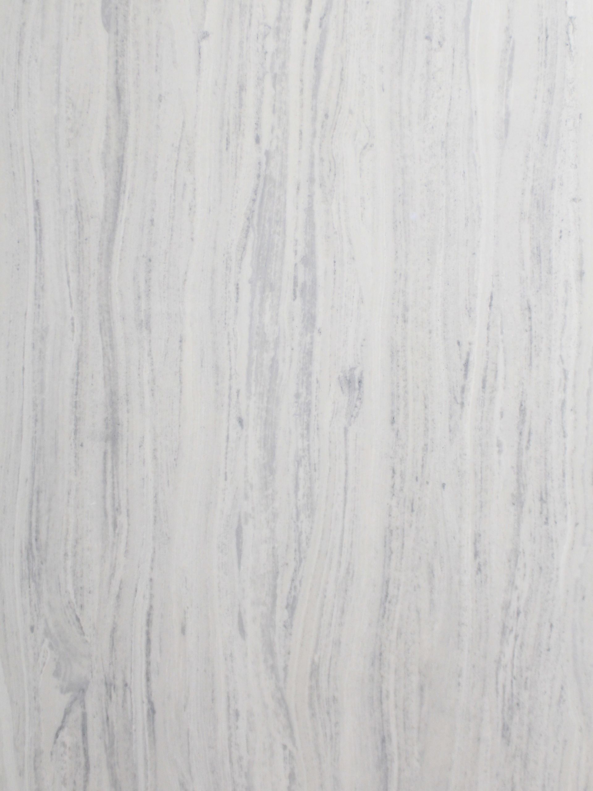 A close up of a white marble counter top.