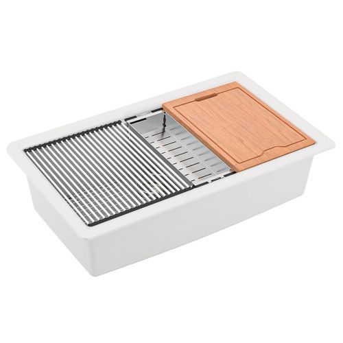 White kitchen sink with a stainless steel grate, cutting board, and a drainage rack.