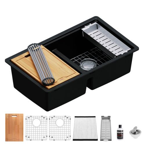 Black double-bowl kitchen sink with accessories: cutting board, dish rack, and drain strainer.