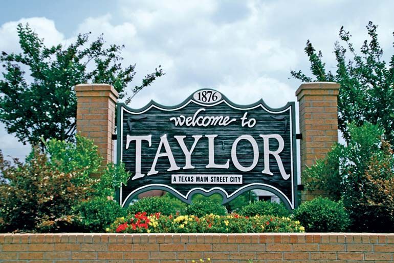 Taylor, TX water tower and downtown – Stetson Property Management local experts.