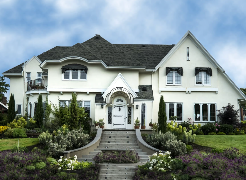 A large white house with a black roof