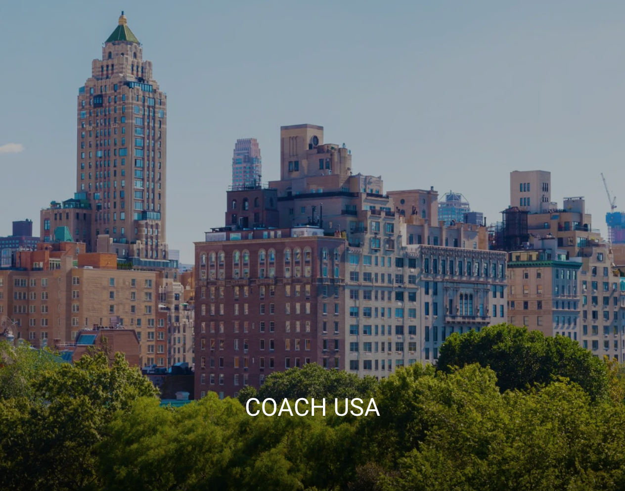 A city skyline with the words coach usa on the bottom