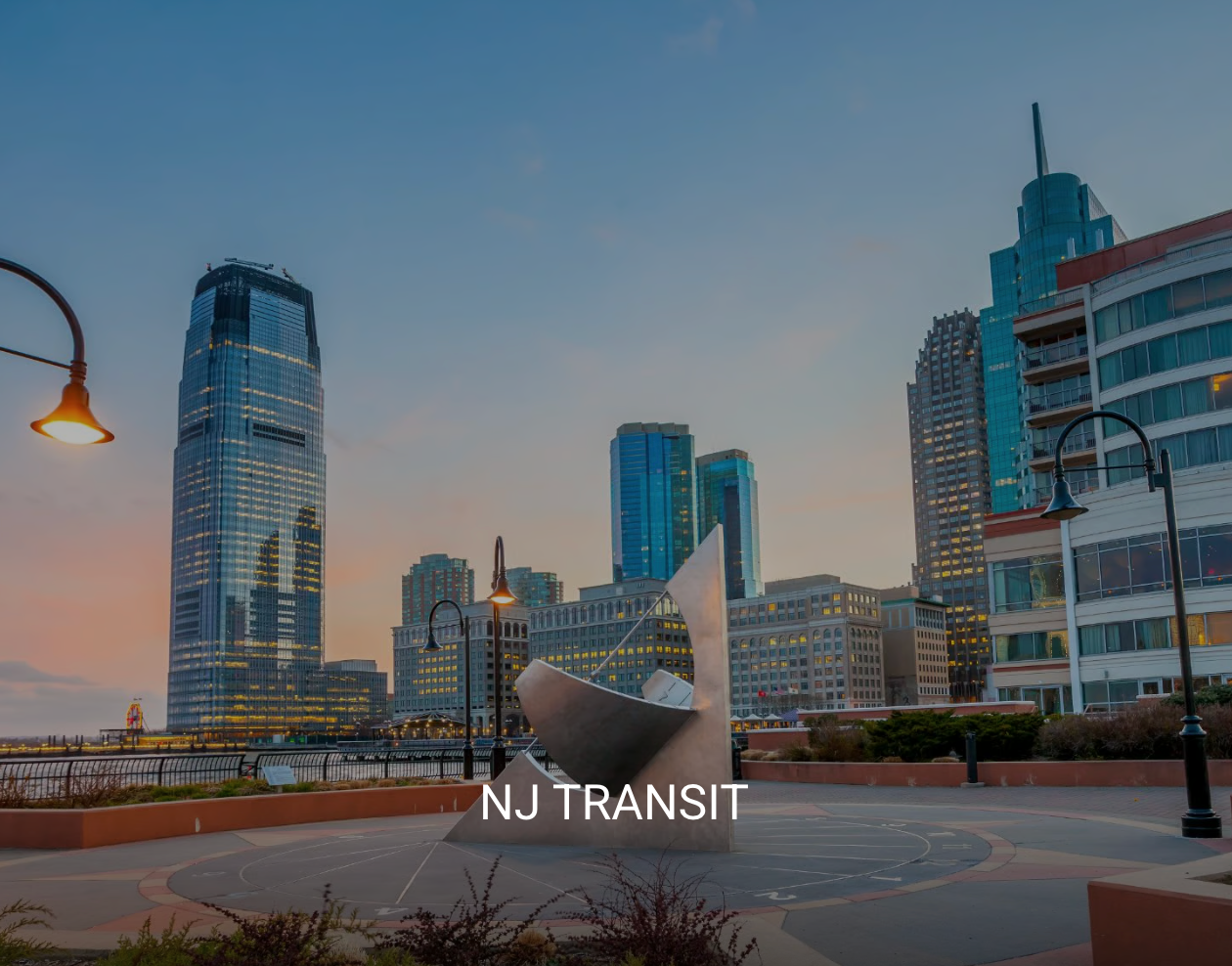 A picture of a city with the words nj transit on the bottom