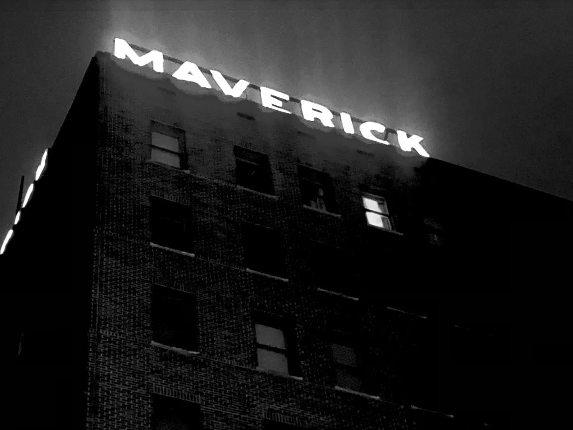 A black and white photo of a maverick building