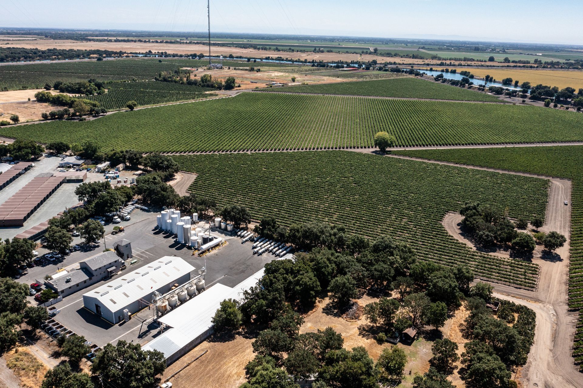 A man is standing in a forklift with the number 1 on it