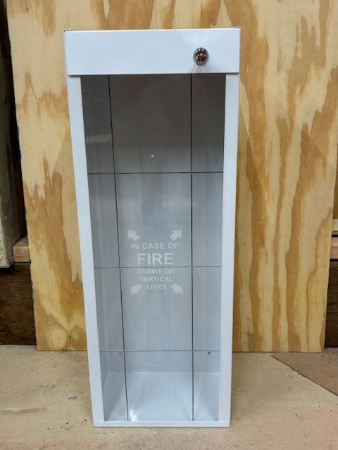 A white case of fire is sitting on a wooden table