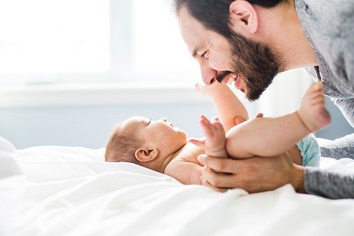 Wellness Exams — Happy Father Playing With Adorable Baby in Milton, FL