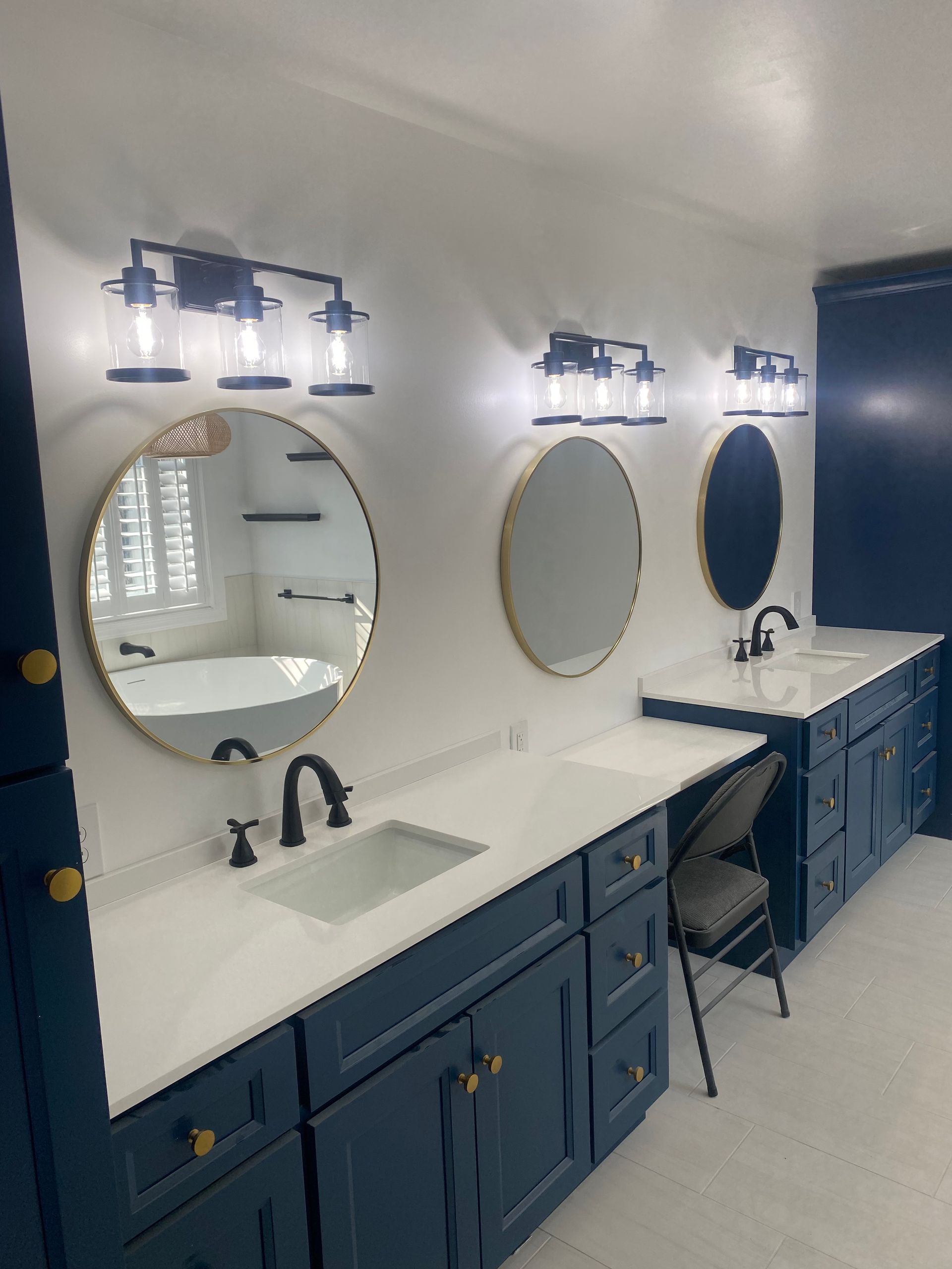 A bathroom with two sinks and two mirrors.