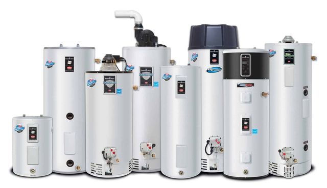 A group of water heaters of different sizes are lined up in a row.