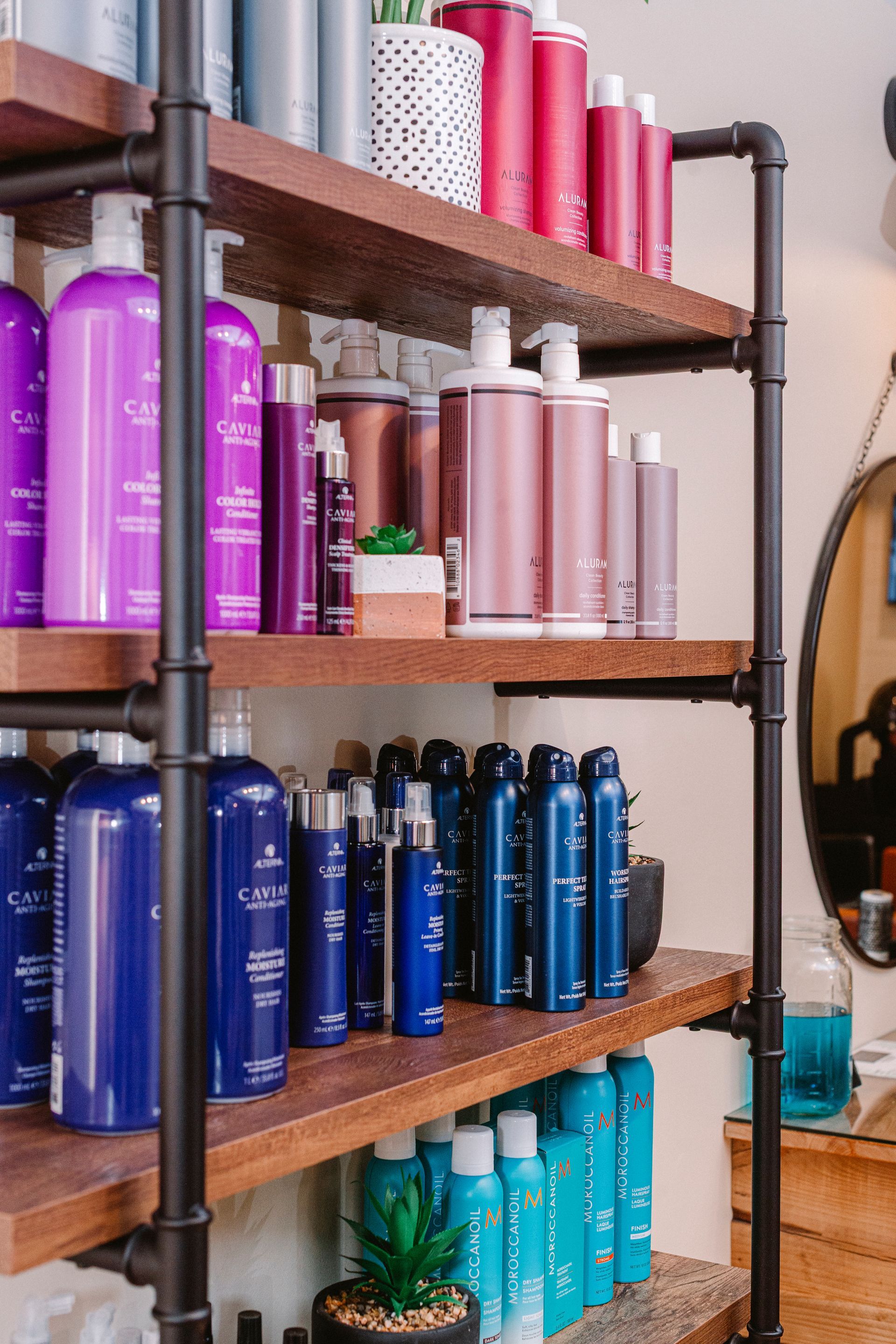 A shelf filled with lots of hair products in a salon.