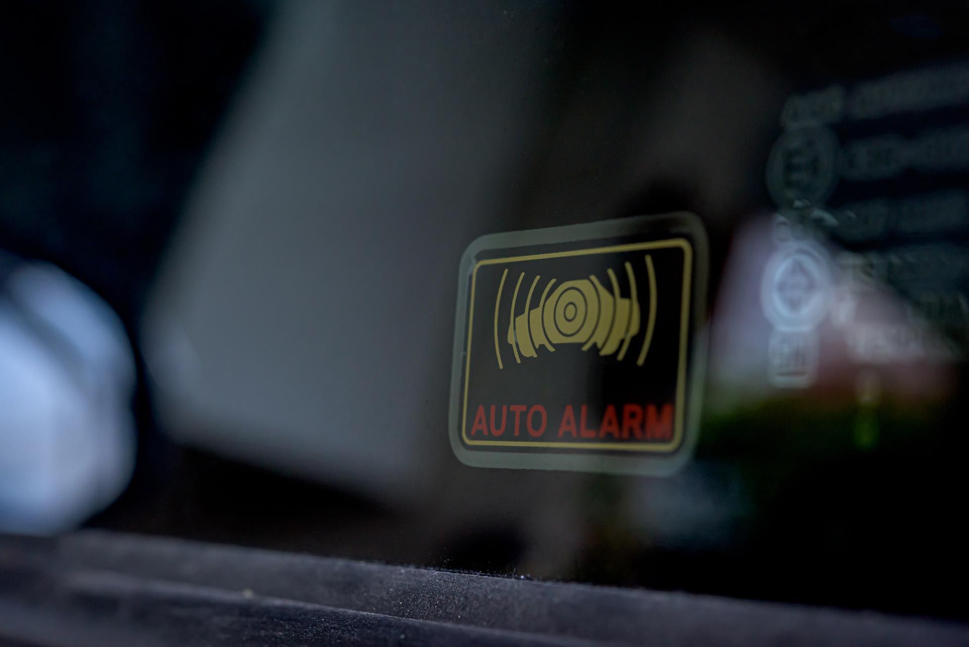 Auto Alarm Sticker on Windshield