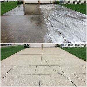 Concrete driveway after professional cleaning and sealing