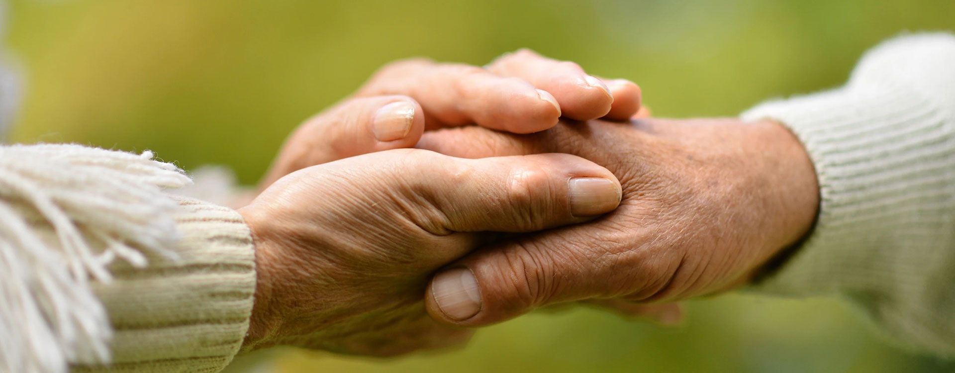 The love of God displayed between an elderly couple holding hands