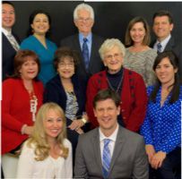 A group of people are posing for a picture together.