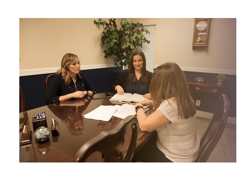 Three Women Working on Papers | Deerfield Beach, FL | Blade Title Company