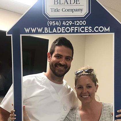 Young Couple Smiling for a Picture | Deerfield Beach, FL | Blade Title Company