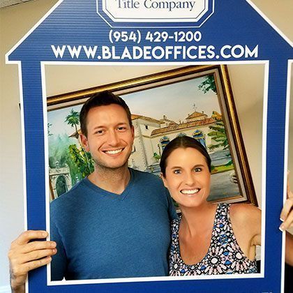 Couple Posing for Picture | Deerfield Beach, FL | Blade Title Company